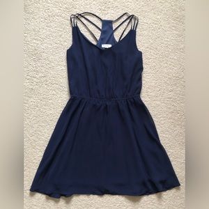Short navy dress with three straps